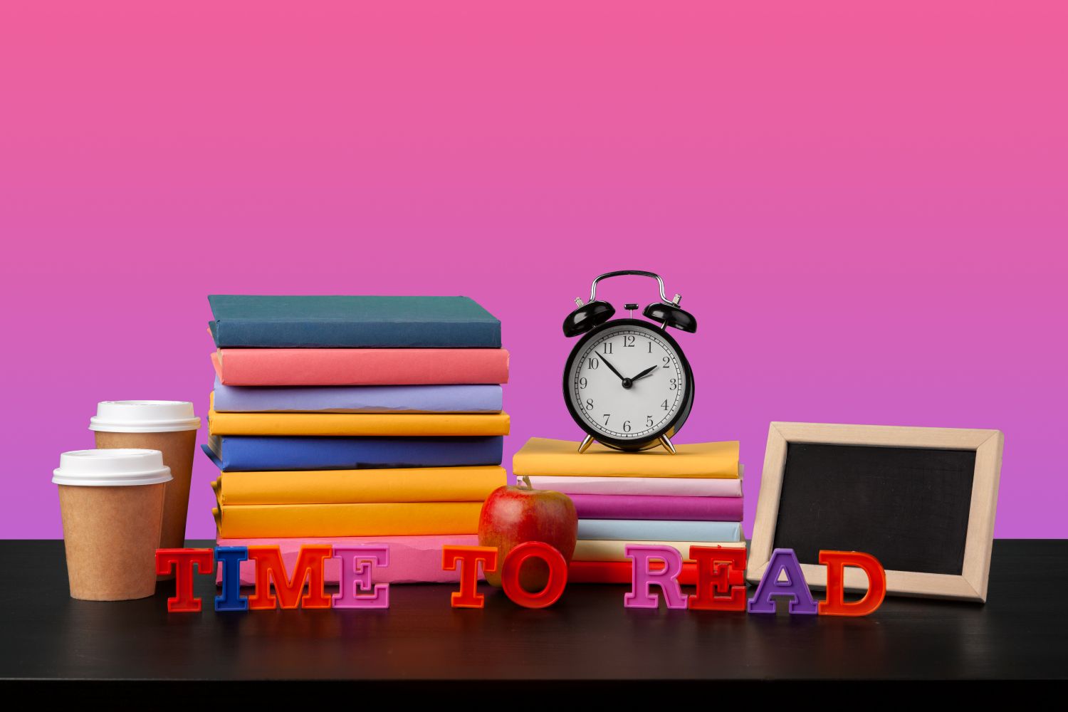 stack-books-black-wooden-table